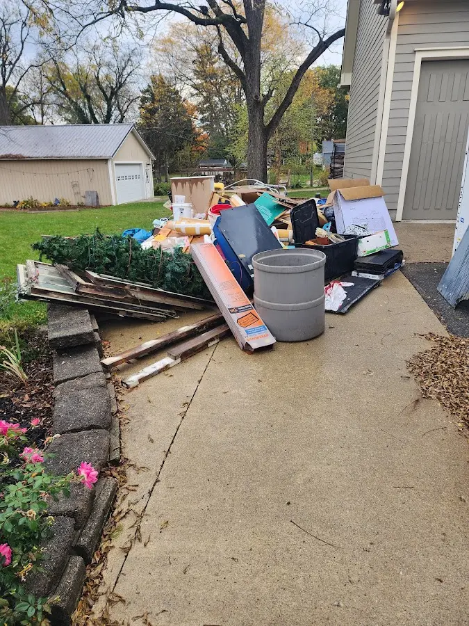 Dumpster being loaded with debris for Commercial Dumpster Rental in El Cerro